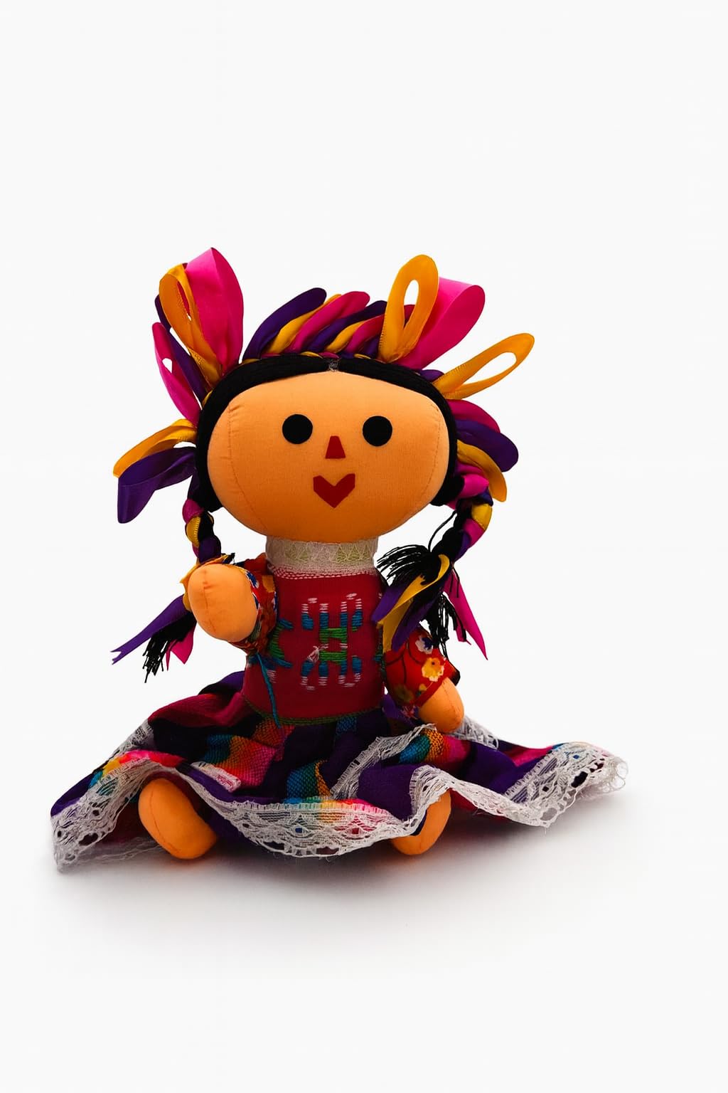 Hand-sewn Mexican Lele rag figurine in traditional folk-art clothing