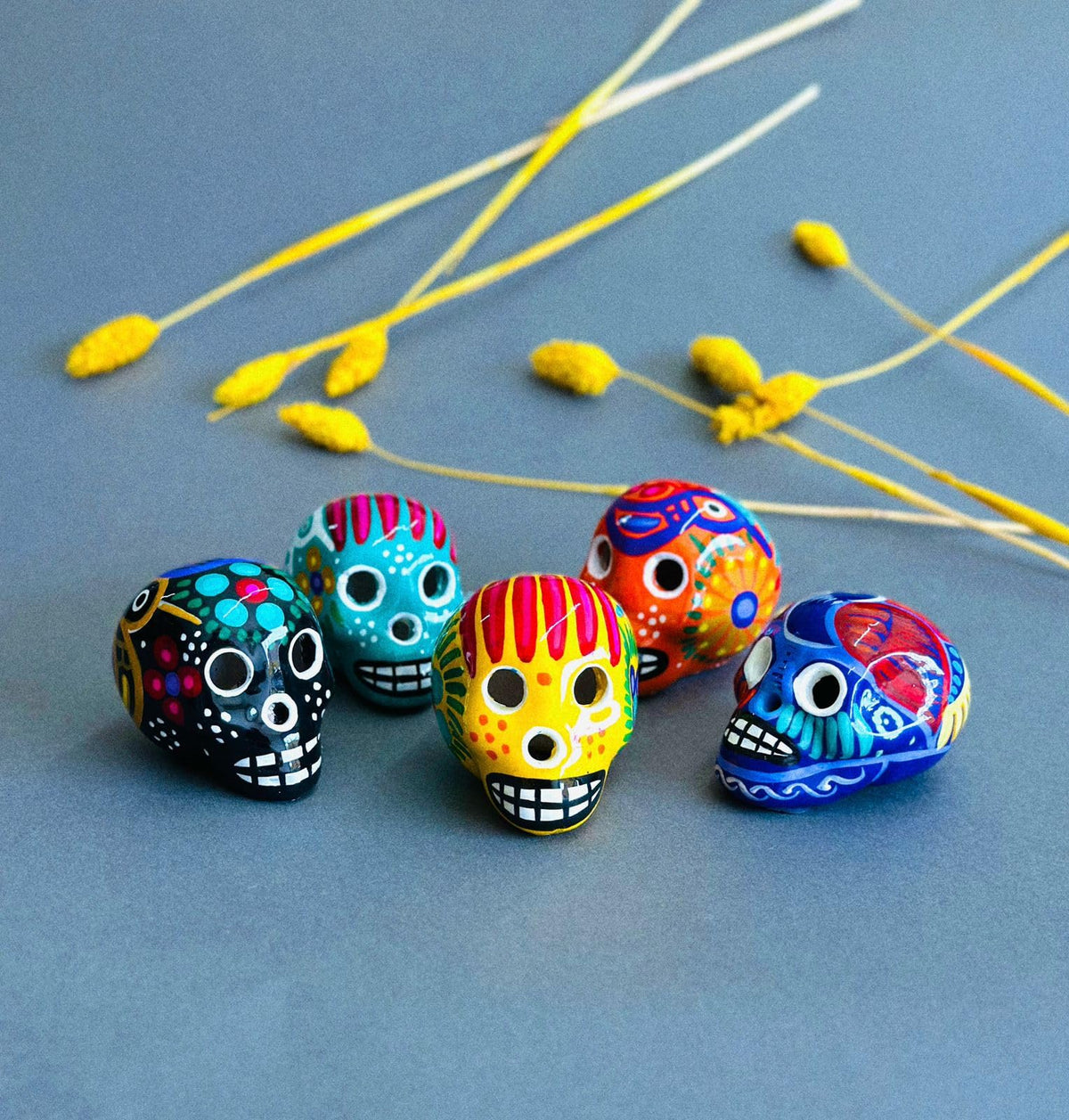 Hand-painted Oaxacan skull wood carvings, set of 5